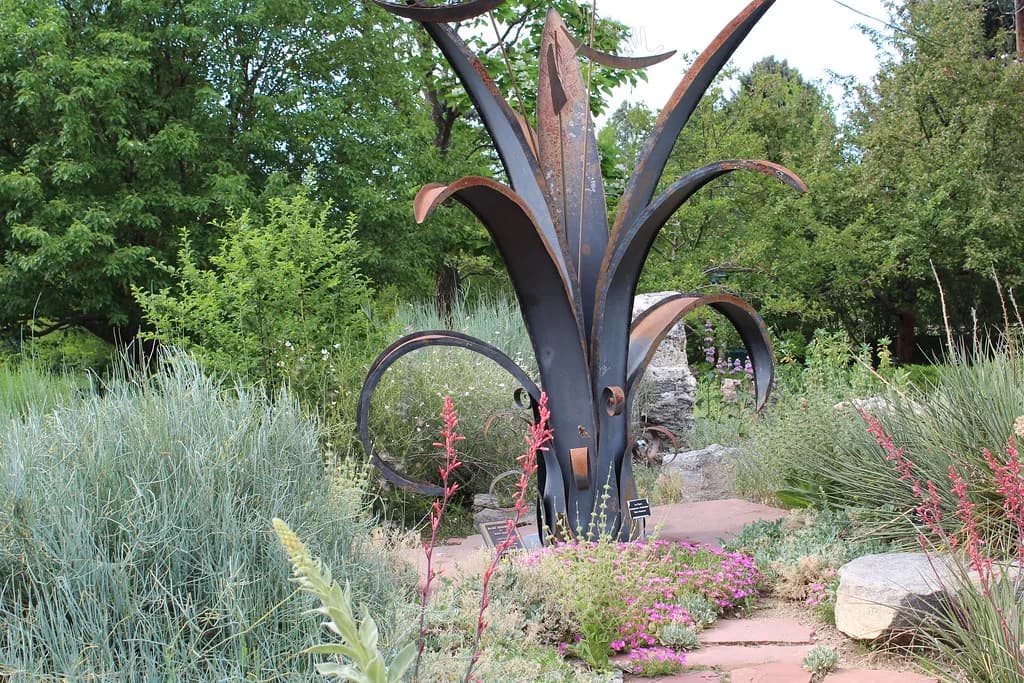 Colorado xeriscape planting — blue grama and other native grasses, yucca, and drought-tolerant perennials in a gravel and flagstone bed